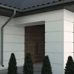 Nowoczesny dom z białymi panelami i drewnianymi wstawkami. Elewacja z subtelnymi wzorami podkreśla architekturę.