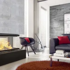 Nowoczesny kominek z betonową obudową, idealny do salonu.